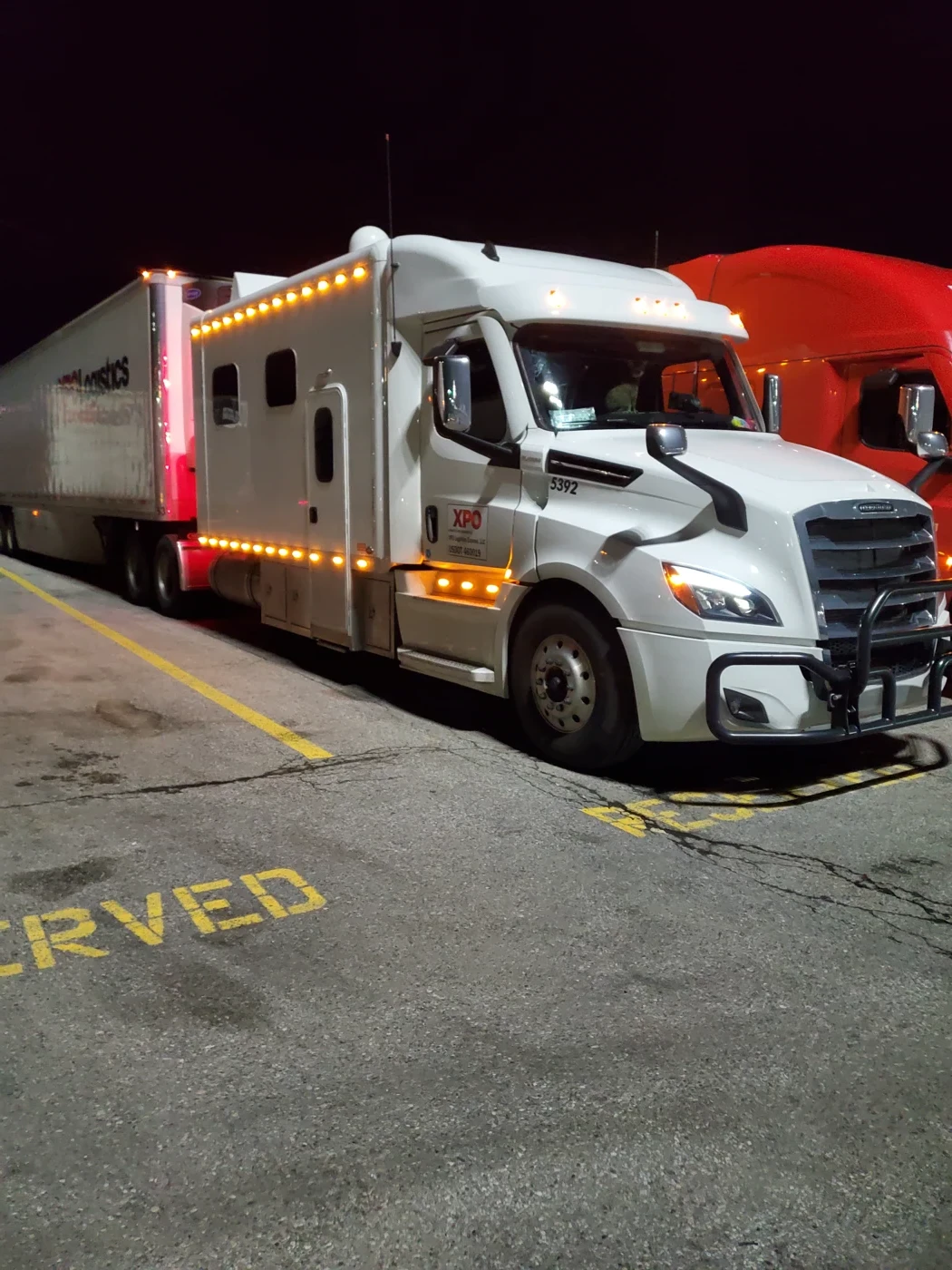 Todd's supplied photograph of a semi truck parked alongside another truck